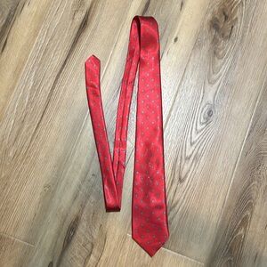 Buckingham tie. Ruby red with small blue flowers. ￼